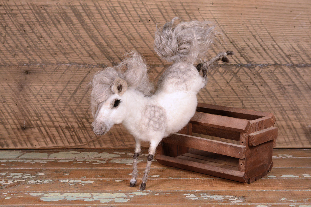 Needle authentic felted pony on a stirrup